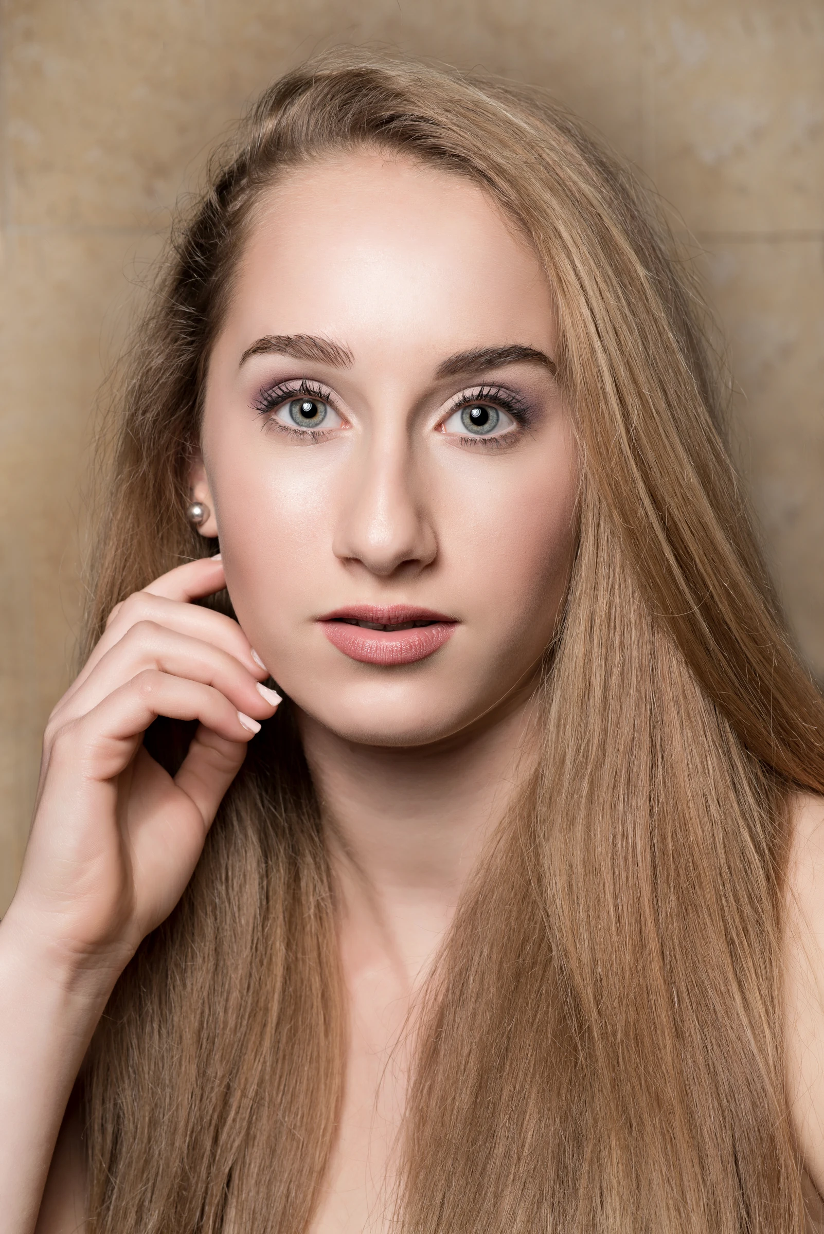 Beauty portrait against a warm backdrop
